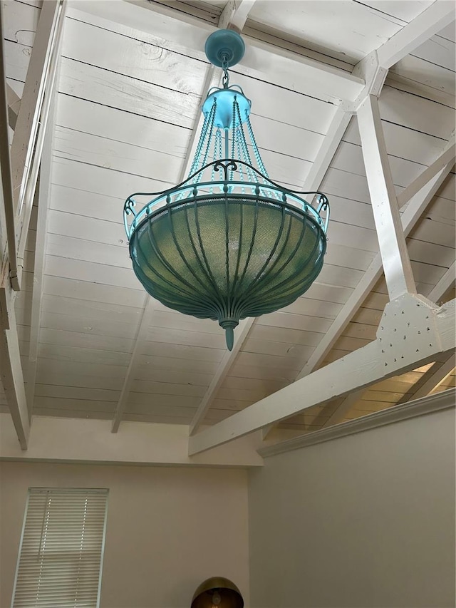 details featuring beam ceiling and wood ceiling