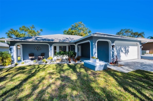 single story home with a garage and a front yard