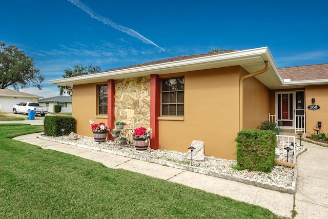 view of side of property featuring a yard