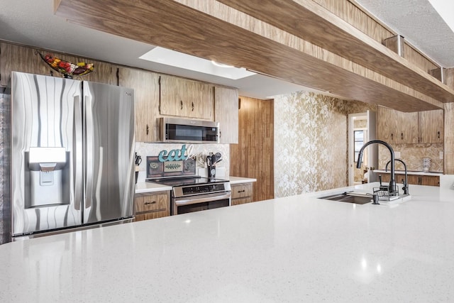 kitchen with sink and stainless steel appliances