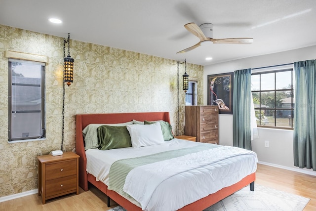 bedroom with hardwood / wood-style flooring and ceiling fan