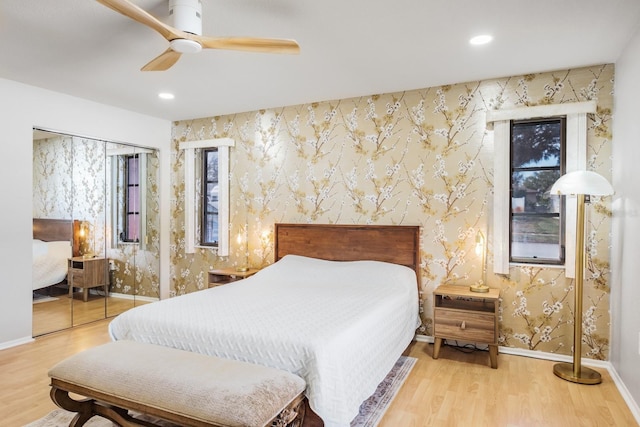 bedroom with ceiling fan and hardwood / wood-style floors