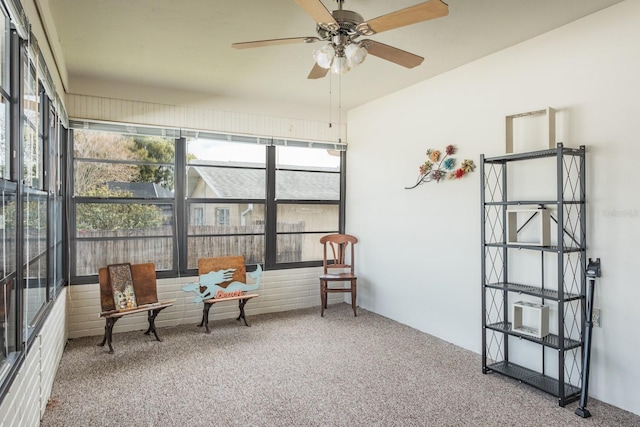 sunroom with ceiling fan and a healthy amount of sunlight