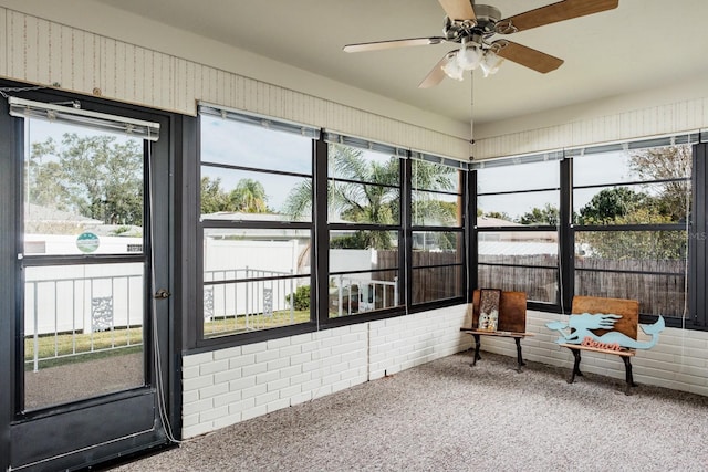 sunroom / solarium with ceiling fan