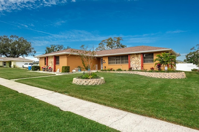 ranch-style house with a front yard