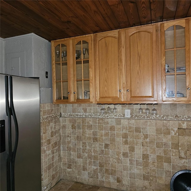 kitchen with stainless steel fridge with ice dispenser and wood ceiling