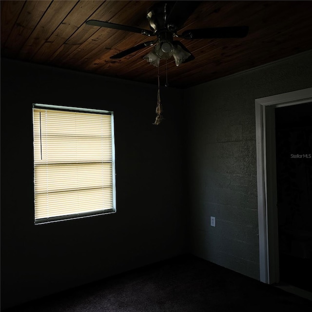 empty room featuring wooden ceiling