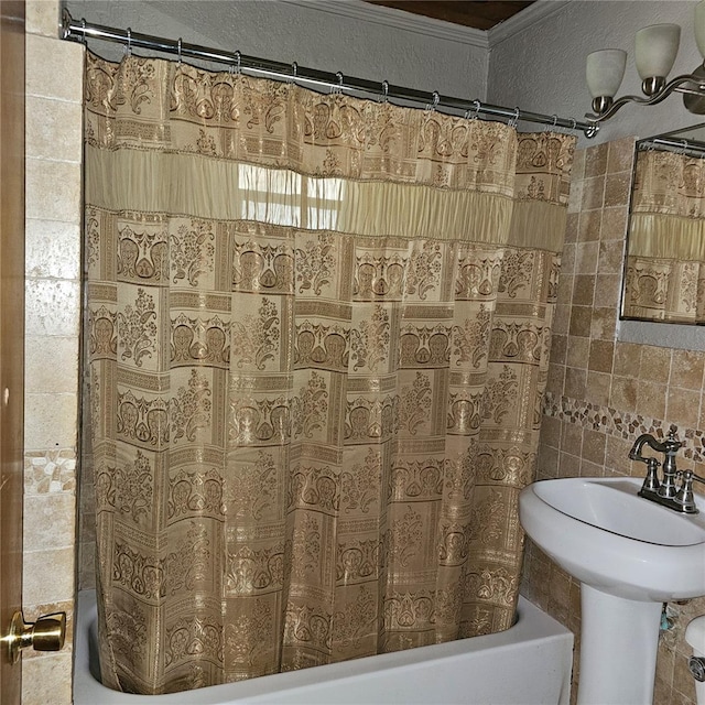 bathroom featuring shower / bath combination with curtain and ornamental molding