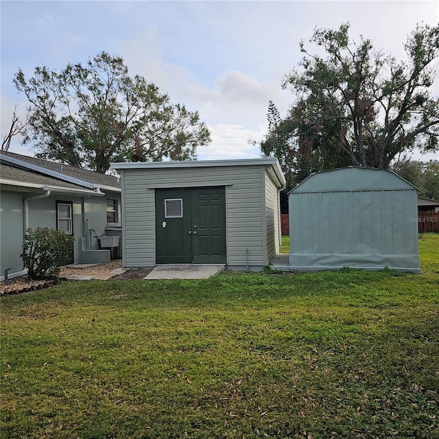 view of outdoor structure with a yard