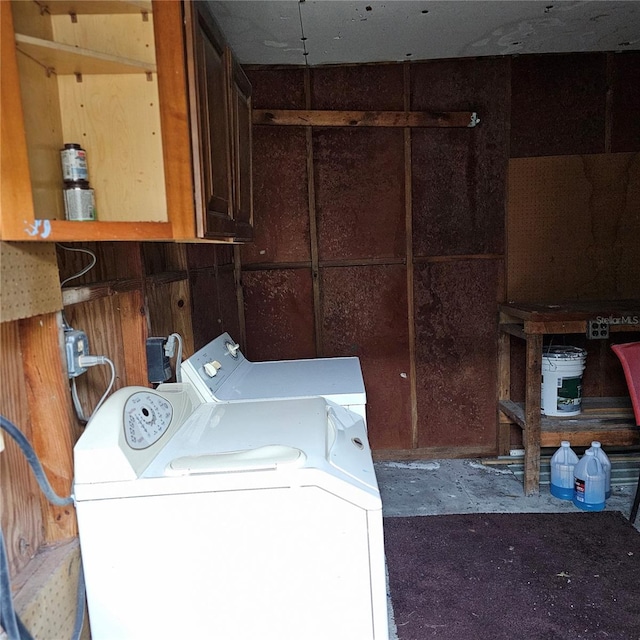 clothes washing area with separate washer and dryer