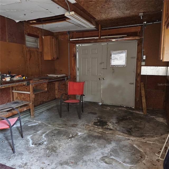 interior space with a workshop area and concrete flooring