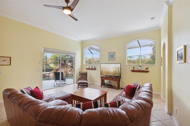 living room featuring ceiling fan, ornamental molding, and light tile patterned flooring