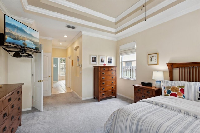 carpeted bedroom featuring a tray ceiling and crown molding