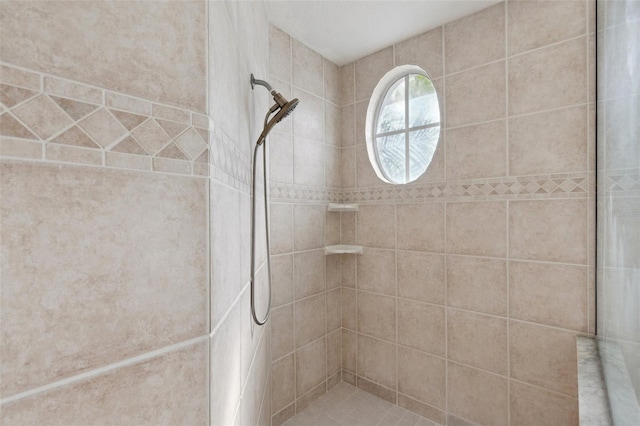 bathroom featuring a tile shower