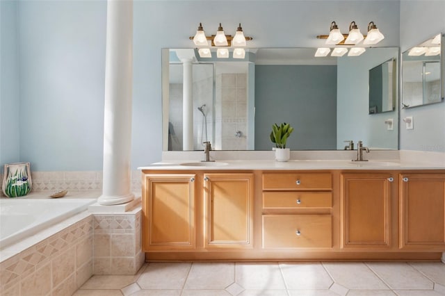 bathroom featuring decorative columns, tile patterned floors, vanity, and plus walk in shower