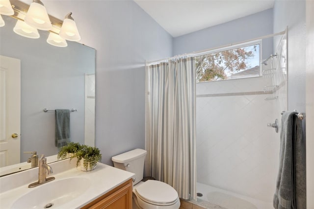 bathroom featuring a shower with shower curtain, vanity, and toilet