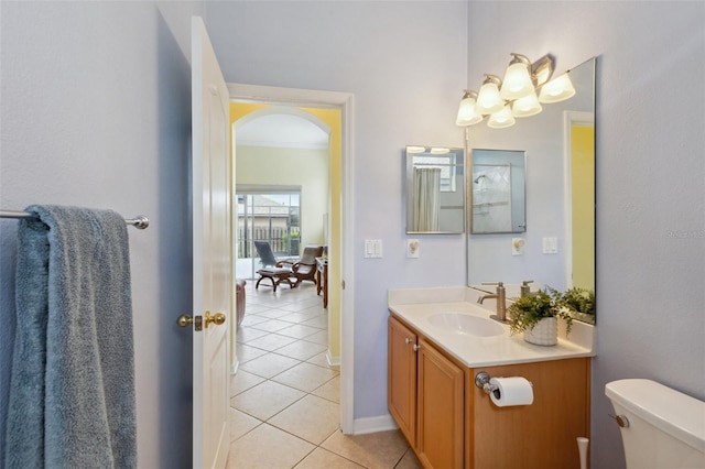 bathroom featuring tile patterned flooring, vanity, and toilet