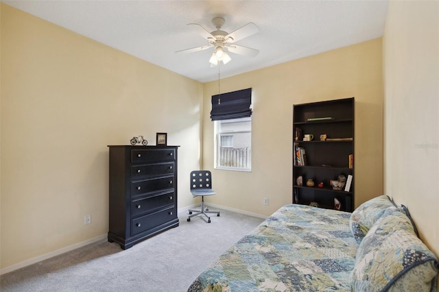 bedroom with ceiling fan and light colored carpet