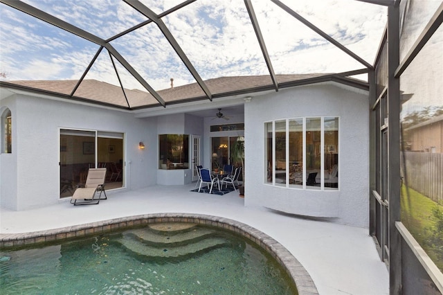 back of house featuring a fenced in pool, ceiling fan, a patio, and a lanai