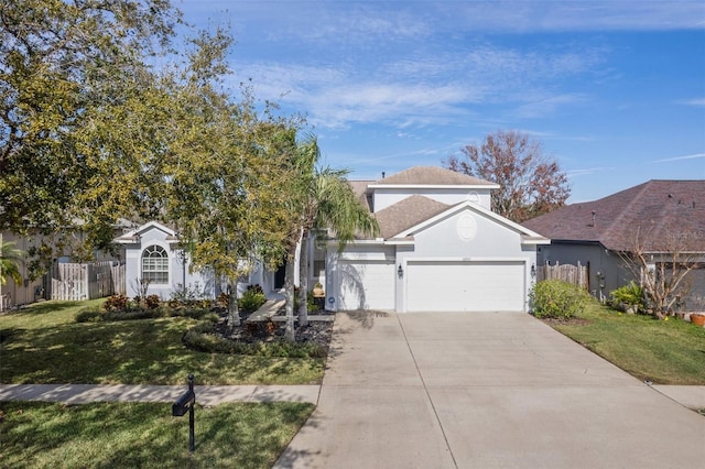 view of front of property featuring a garage and a front yard