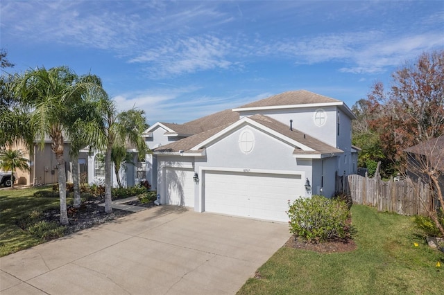 view of property with a garage and a front yard