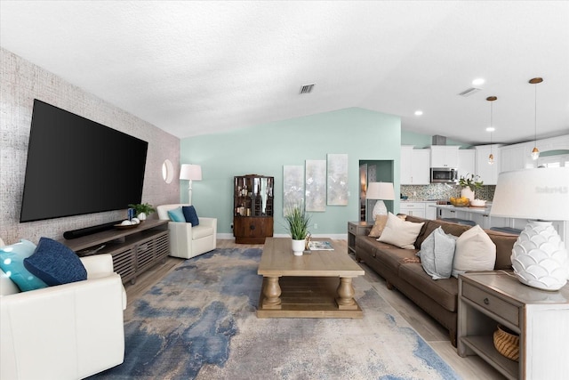 living room with lofted ceiling