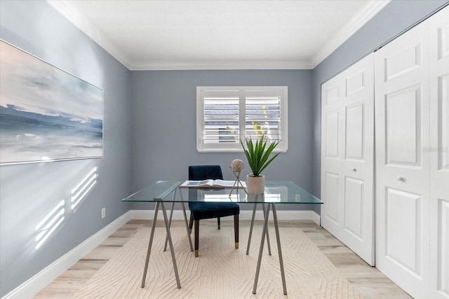 home office featuring crown molding and light wood-type flooring