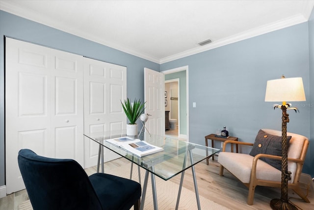 office with crown molding and light wood-type flooring