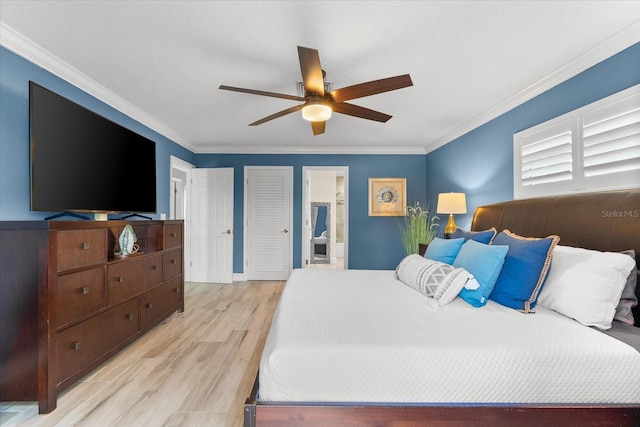 bedroom featuring crown molding, ceiling fan, ensuite bathroom, and light hardwood / wood-style floors