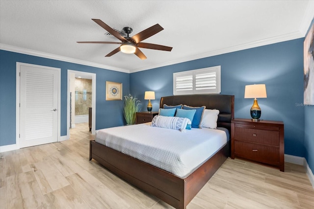 bedroom featuring ornamental molding, ceiling fan, light hardwood / wood-style floors, and ensuite bath