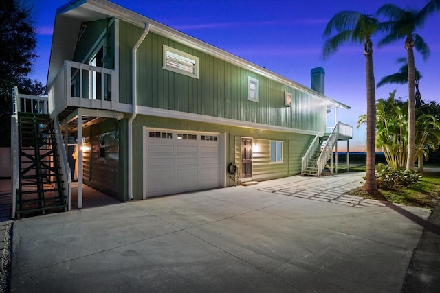 property exterior at dusk with a garage