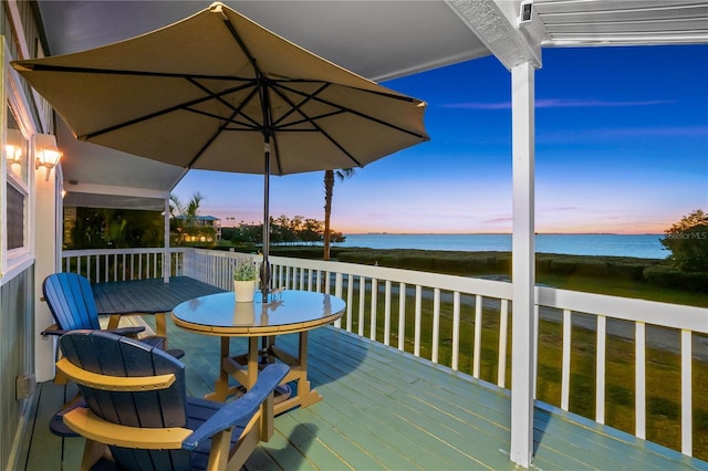 deck at dusk with a water view