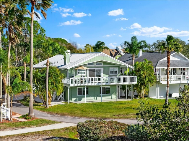 rear view of house with a yard