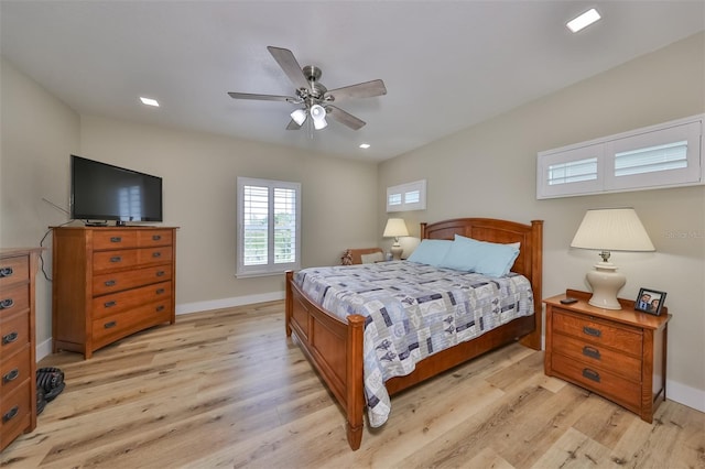 bedroom featuring light hardwood / wood-style floors and ceiling fan