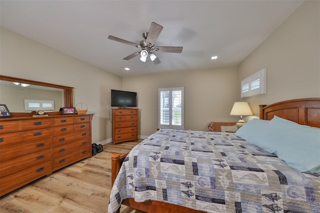 bedroom featuring light hardwood / wood-style floors and ceiling fan