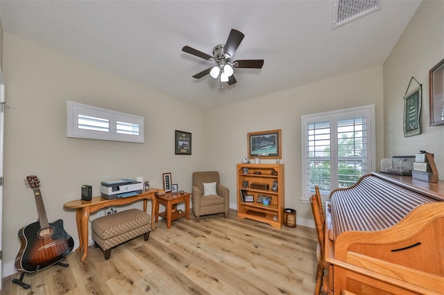 interior space with ceiling fan and light hardwood / wood-style floors