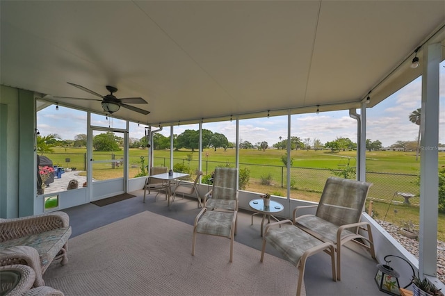 sunroom featuring ceiling fan