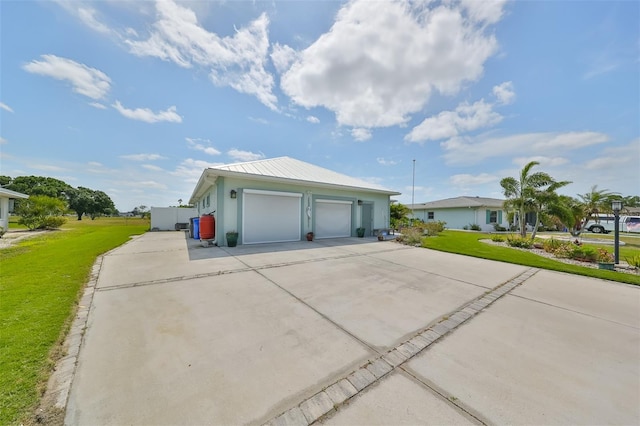 garage featuring a lawn