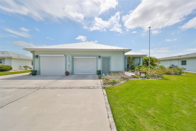 ranch-style home with a garage and a front lawn