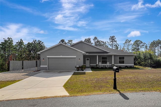 view of front of property featuring a front yard and a garage