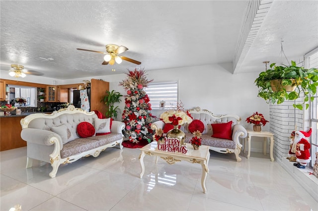 tiled living room with a textured ceiling