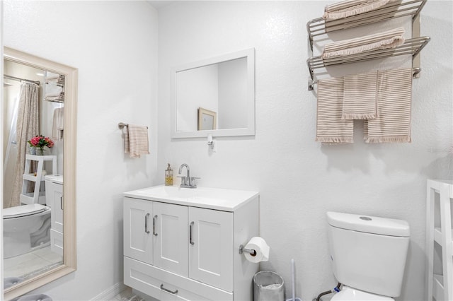 bathroom with vanity and toilet