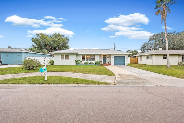 single story home featuring a front yard and a garage