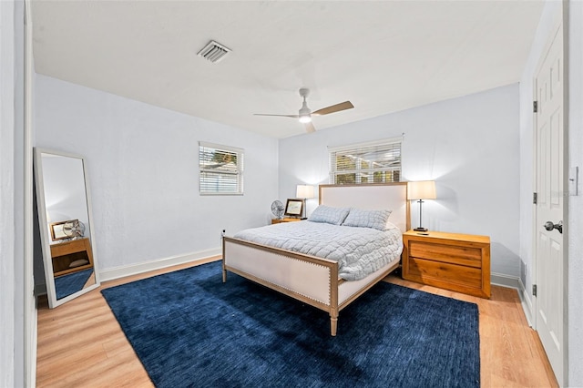 bedroom featuring hardwood / wood-style floors and ceiling fan