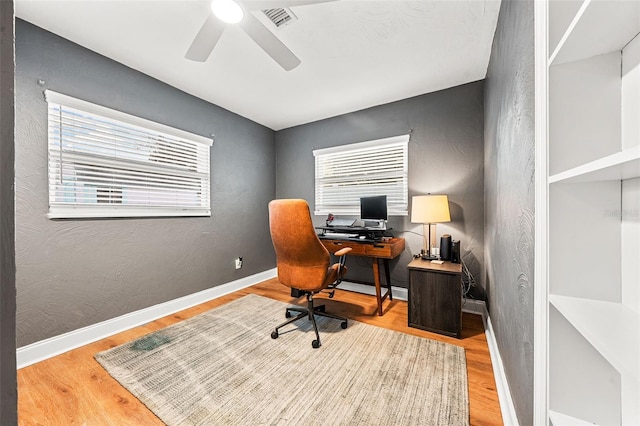 home office featuring ceiling fan and hardwood / wood-style floors