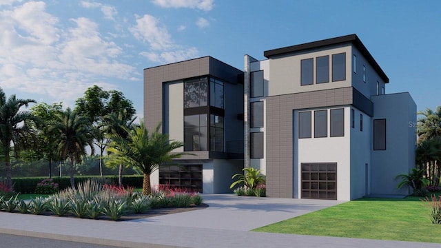 view of front of property featuring a garage, a front yard, concrete driveway, and stucco siding