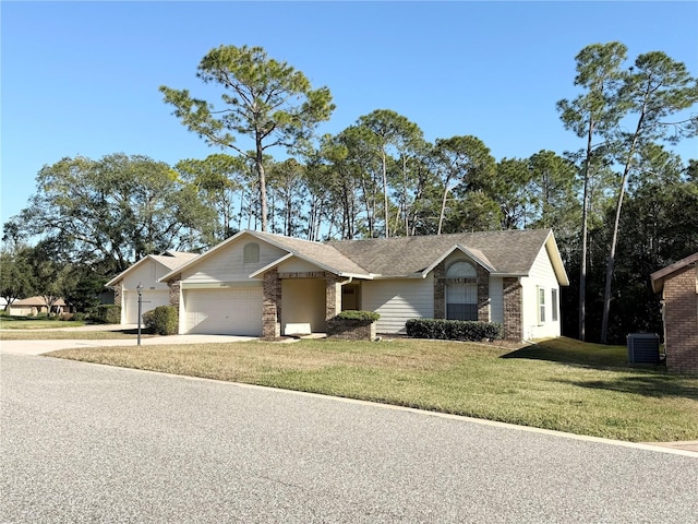 ranch-style house with central air condition unit, a front yard, and a garage