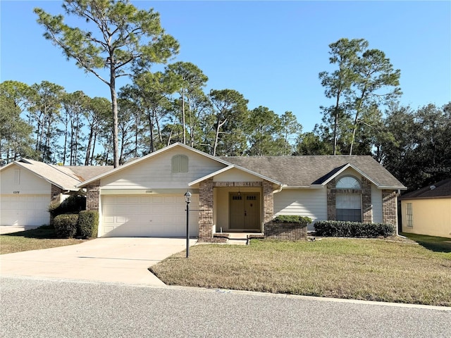 ranch-style home featuring a garage and a front lawn