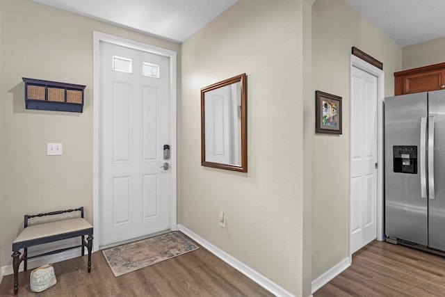 entryway with dark hardwood / wood-style floors