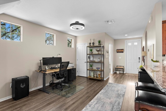 office space with dark hardwood / wood-style flooring